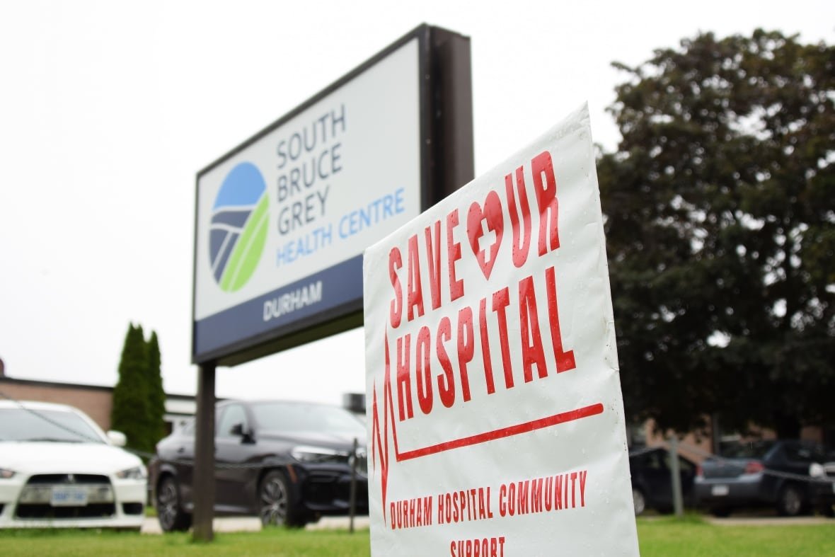 durham-hospital-campaign A lawn sign that says "save our hospital" is set up in front of the hospital's sign that reads "South Bruce Grey Health Centre - Durham"