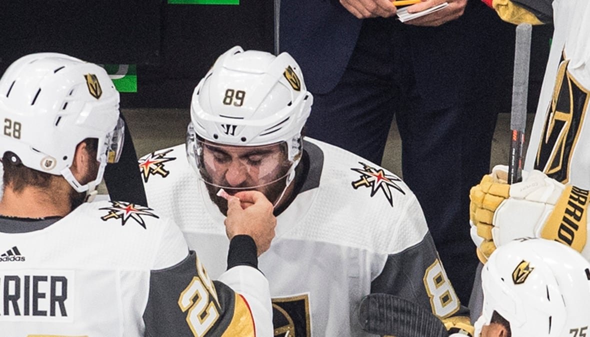 hkn-knights-canucks-20200830 Vegas Golden Knights' William Carrier (28) and Alex Tuch (89) share smelling salts.