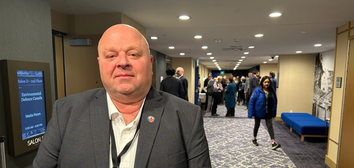 john-di-nino-president-amalgamated-transit-union-canada-oct-28-2024 A man with shaved head stands in a long hallway
