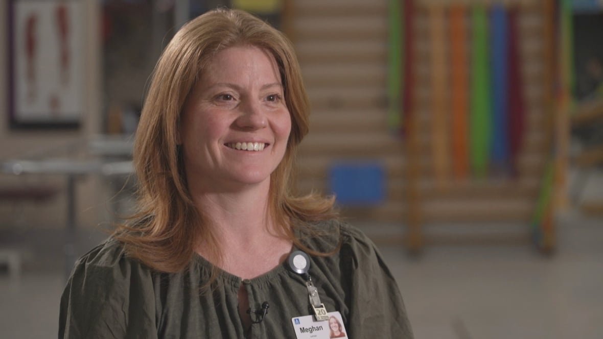 meghan-leroux A woman wearing a hospital badge smiling