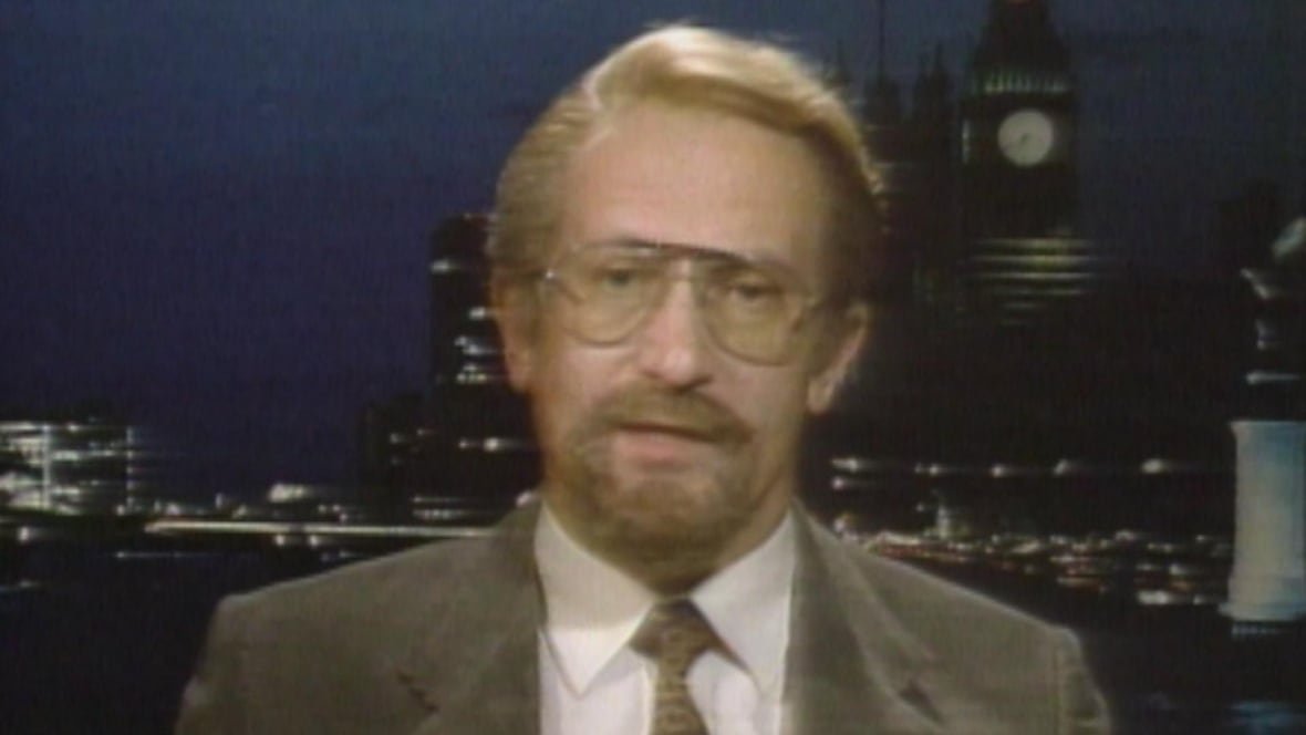 oleg-gordievsky-cbc-s-the-journal A man in a suit and wearing glasses is interviewed on TV.