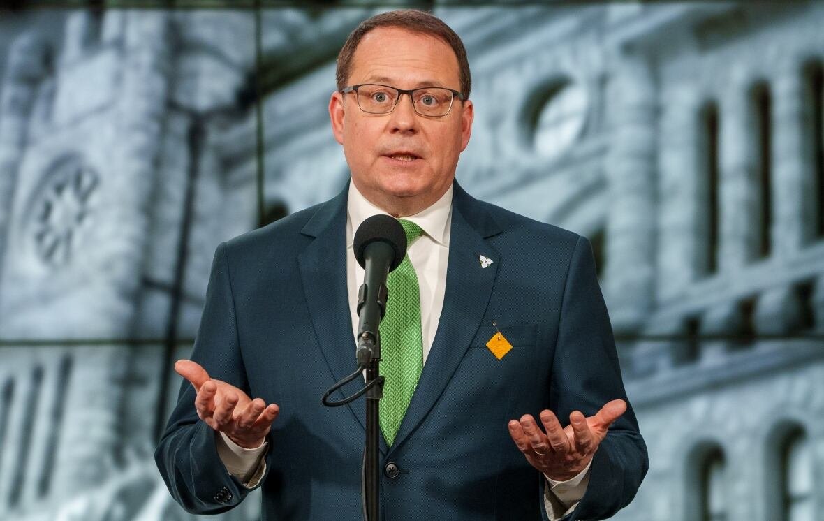 ontario-leaders-debate-5 Mike Schreiner with image of Queen's Park in the background.