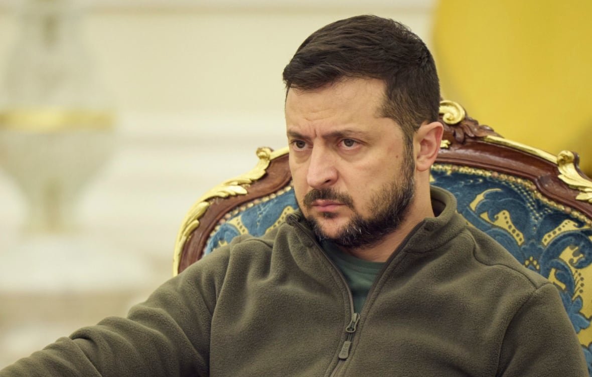 russia-ukraine-war-1 A bearded man sits in an ornate chair, looking forward. He doesn't look happy.