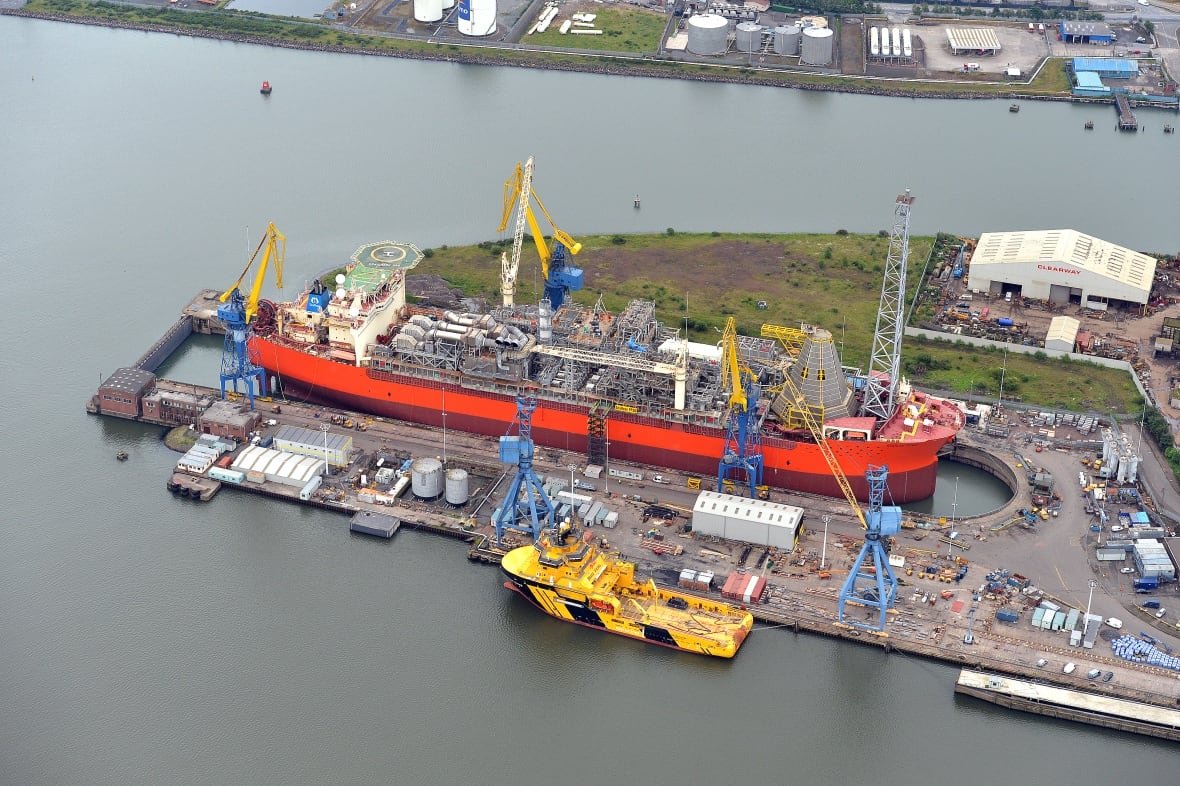 An aerial photo of the SeaRose oil production vessel inside a drydock at a shipyard in Ireland.