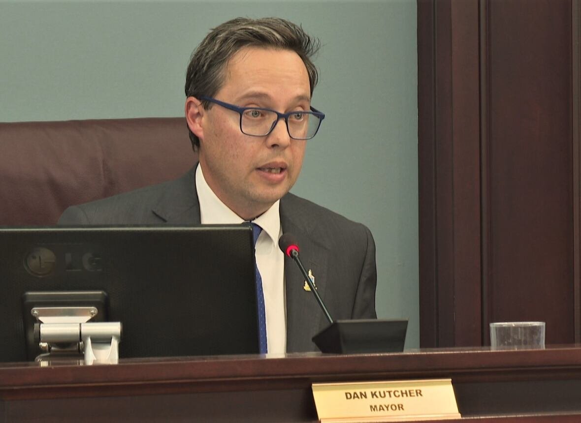 summerside-mayor-dan-kutcher Dan Kutcher speaking at his desk in the Summerside council chamber.