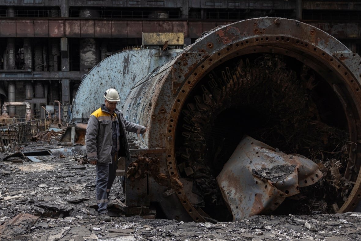 ukraine-crisis-power-1 An employee walks next to a turbine at a thermal power plant damaged by multiple Russian missile strikes, amid Russia's attack on Ukraine, in an undisclosed location in Ukraine March 17, 2025.
