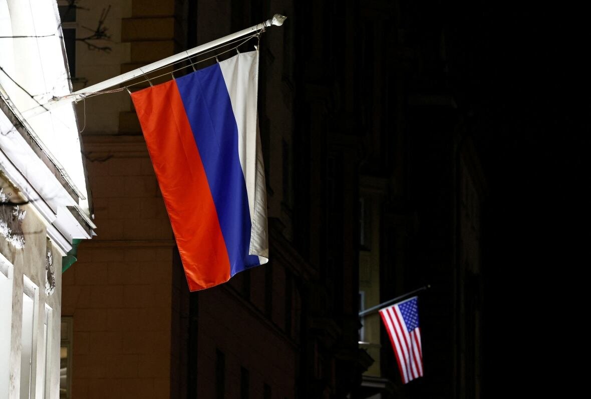 ukraine-crisis-putin-trump-usa-embassy A view shows the Russian flag on the facade of a historic building alongside the American flag on the facade of the U.S. Embassy in Moscow, Russia March 18, 2025.