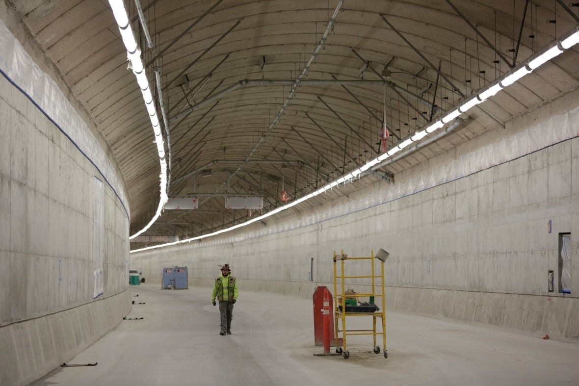 usa-infrastructure-seattle A worker stands in a large empty tunnel