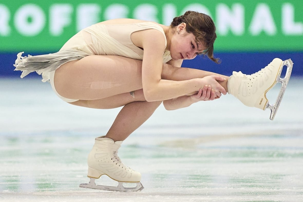 2206461329 A women's figure skater competes.