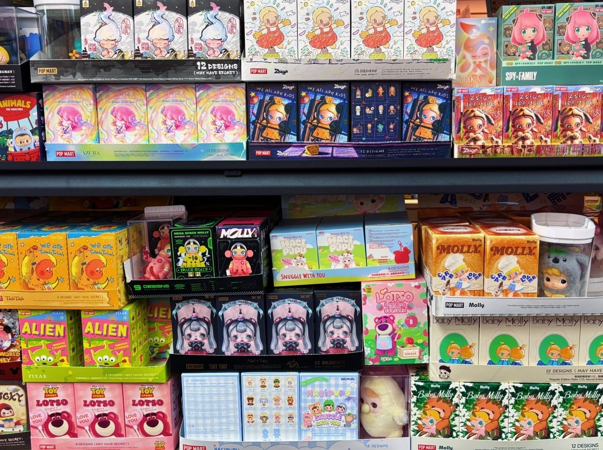 Two shelves with various colourful blind boxes
