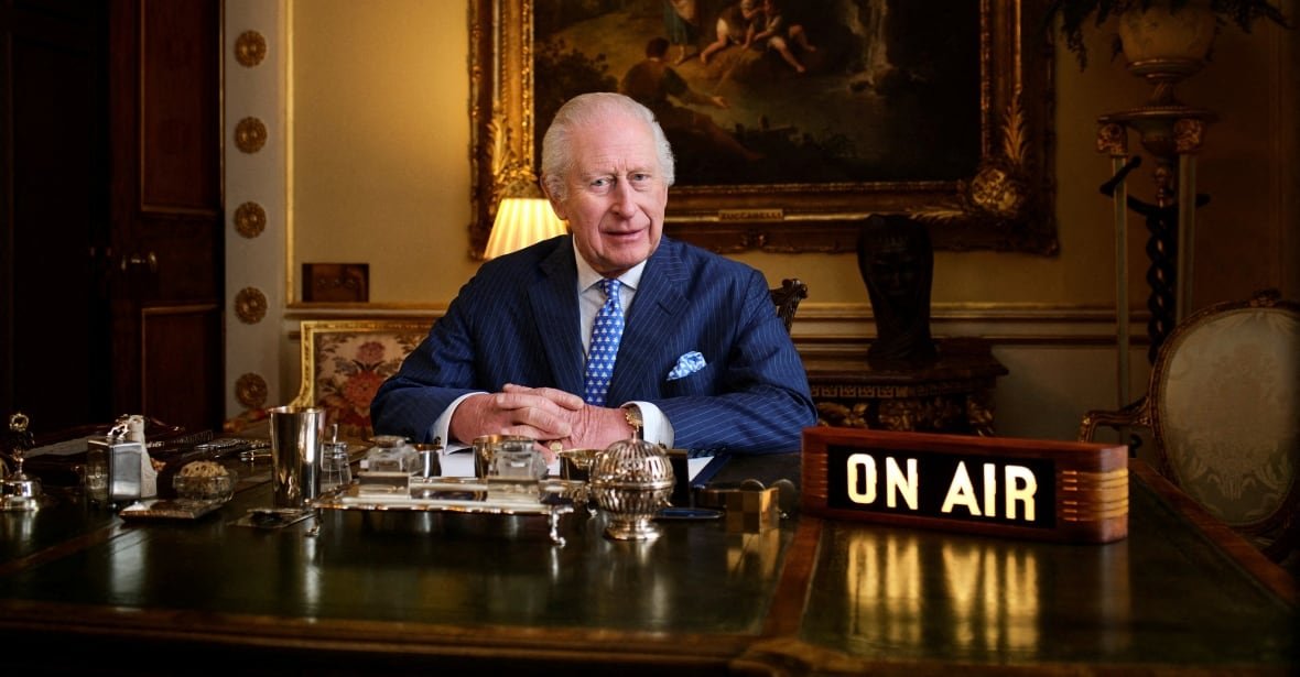 britain-royals-king A person sits as a desk with a box that says 'on air' beside them.