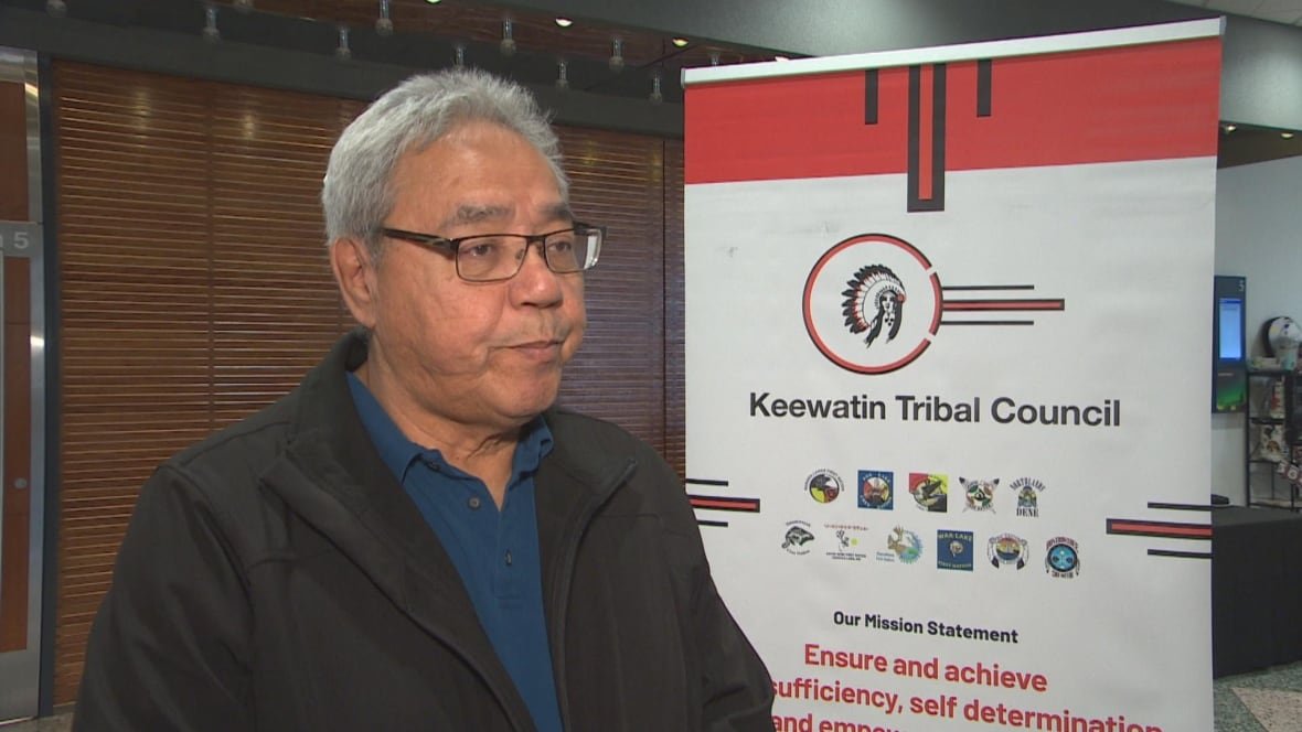 keewatin-tribal-council-grand-chief-walter-wastesicoot A man in glasses and with a black jackets looks at a camera.