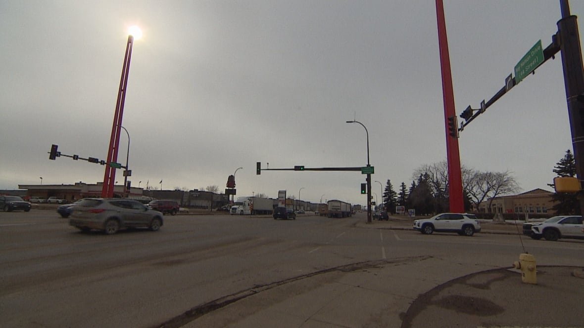 provincial-markets Giant roadside red posts stand along a roadway.