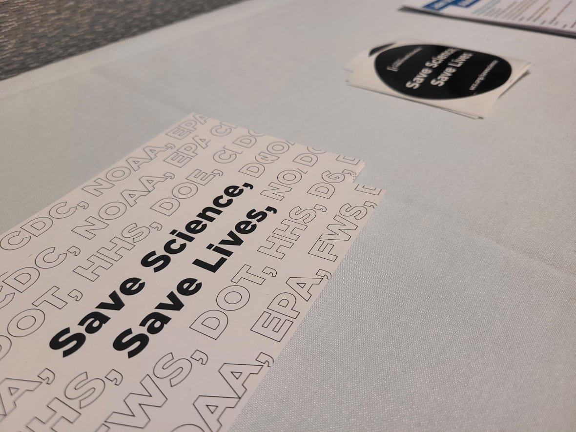 stickers Stickers that read 'save science, save lives'