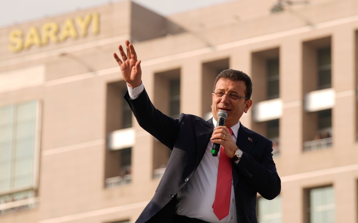 turkey-politics A person gestures while speaking with a microphone.