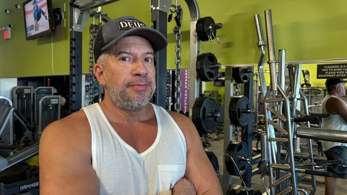 nick-morabito-1 Man in a gym with arms crossed.