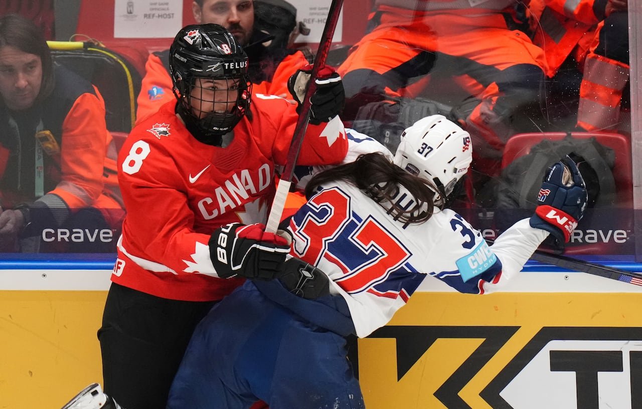 default-109 Two players collide on the boards in a hockey game.