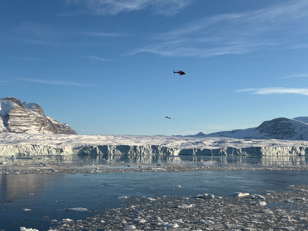 default-847 helicopter flies over glacier