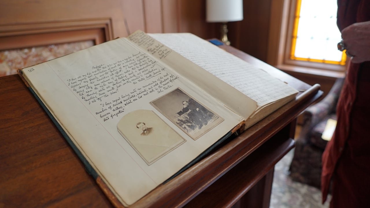 Old photographs in a journal.