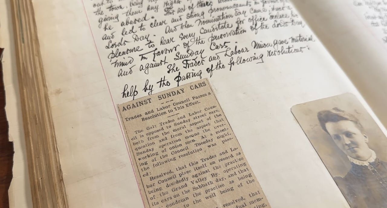 A newspaper clipping in an old journal.