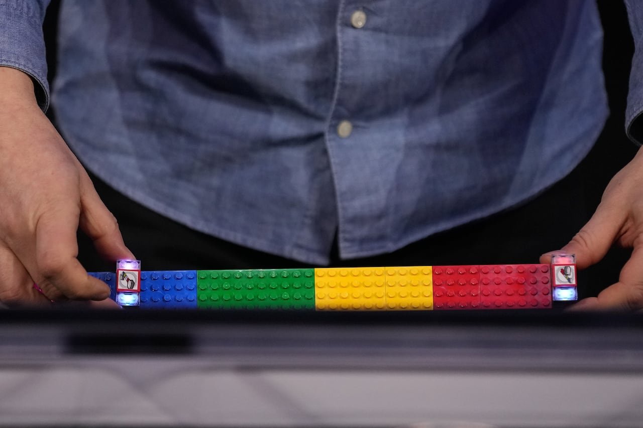 default-517 A person demonstrating smart LEGO bricks.