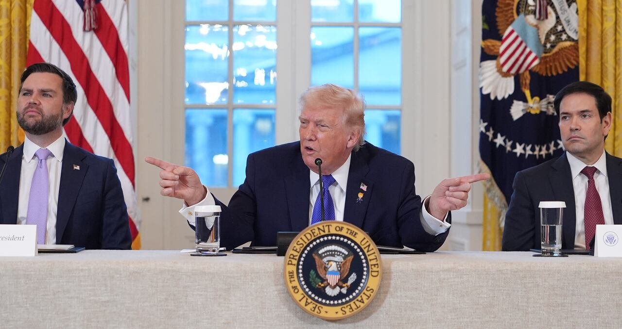 default-200 The President gestures with his fingers while talking into a microphone.