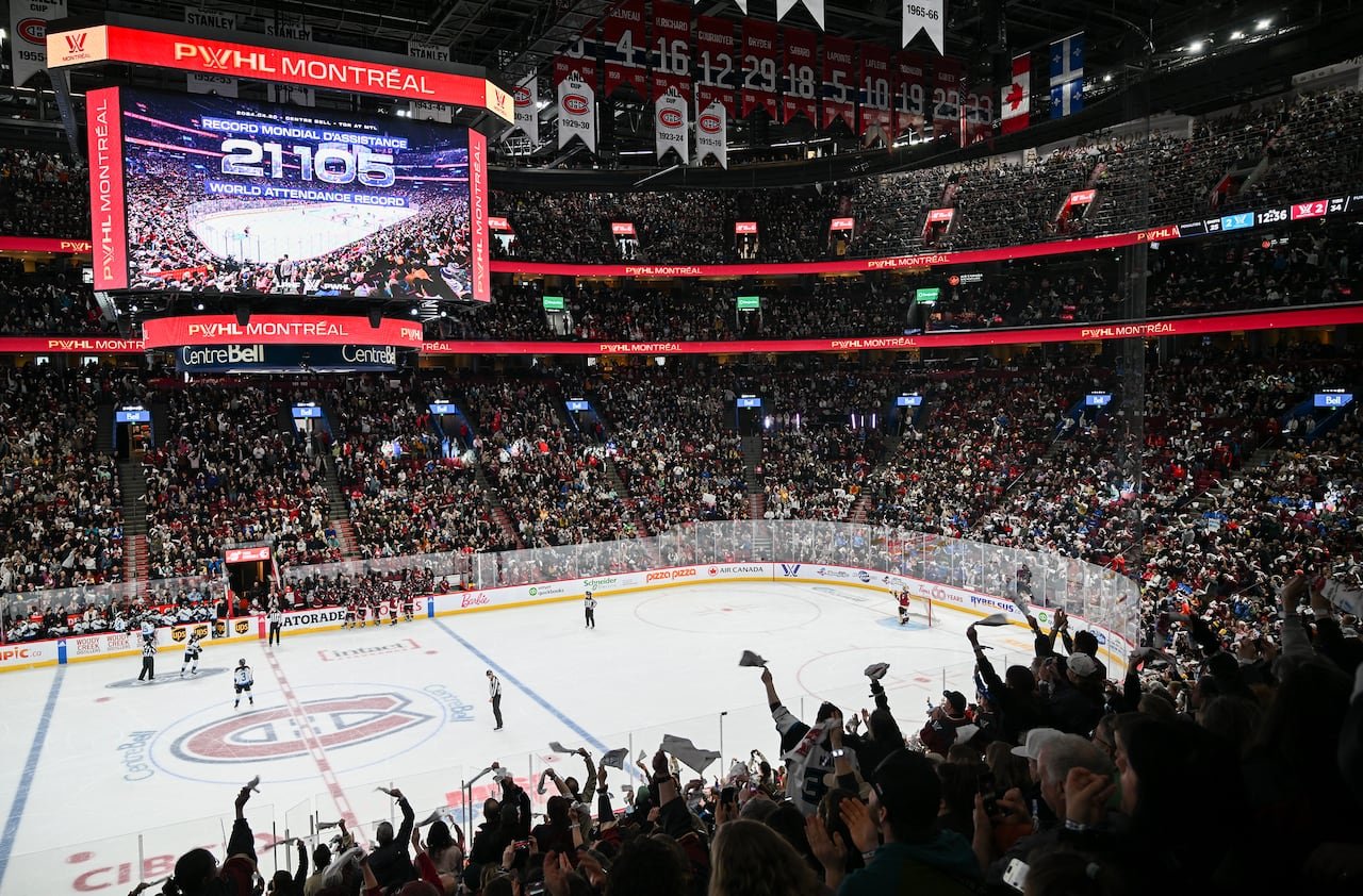default-272 Fans cheer inside a hockey arena.