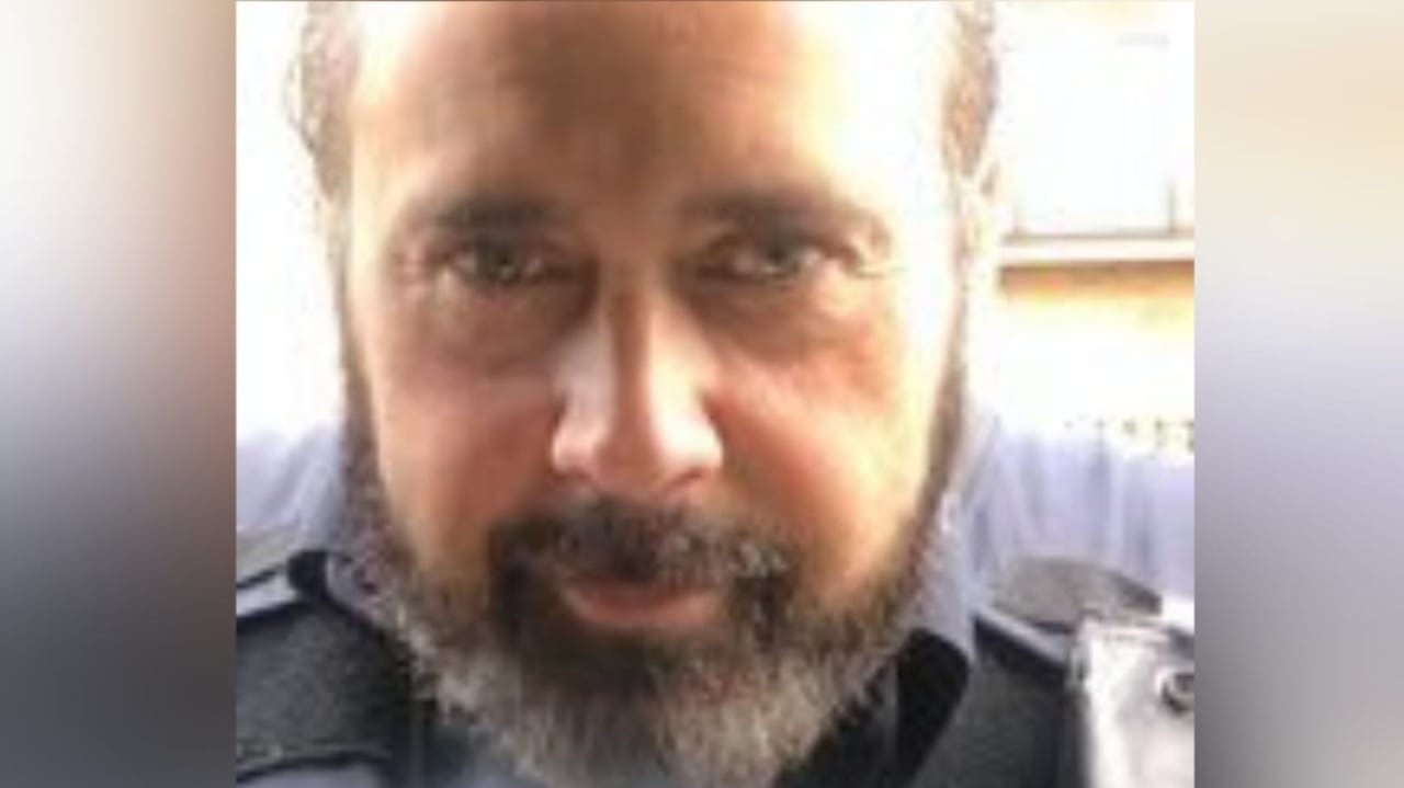 Close up selfie of a man with a coffee cup.